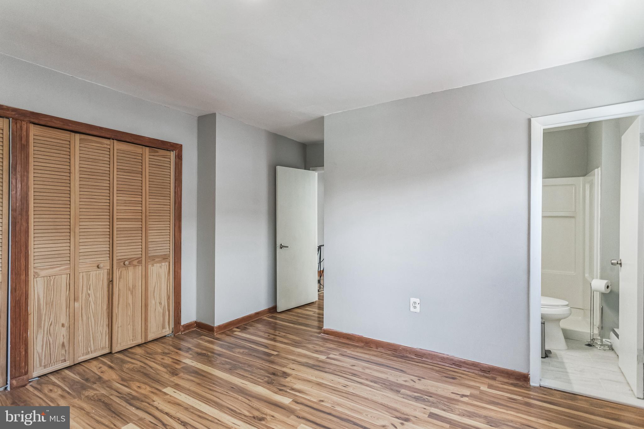 1125 Solly Avenue Philadelphia, PA 19111 - Photo 30 of 49 a view of a room with wooden floor and a bathroom