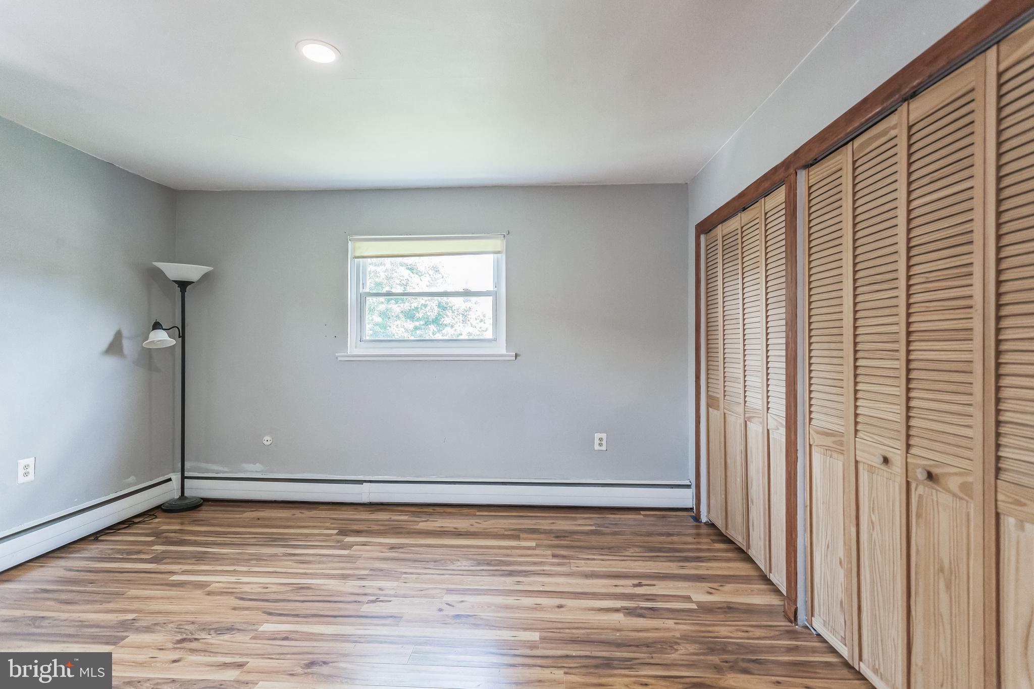 1125 Solly Avenue Philadelphia, PA 19111 - Photo 33 of 49 a view of an empty room with wooden floor and a window