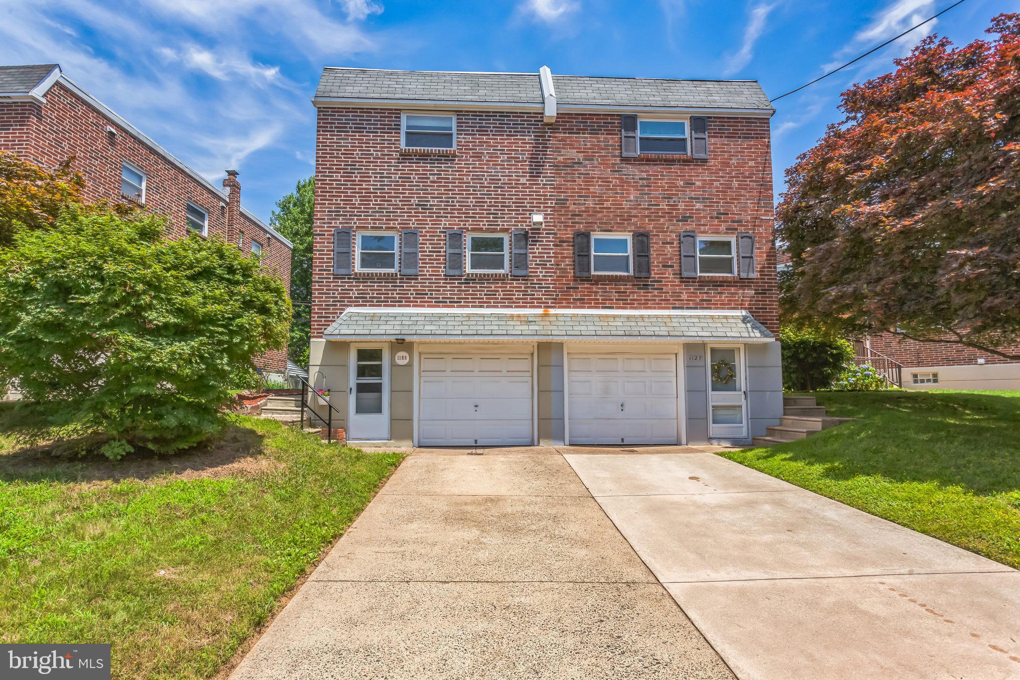 1125 Solly Avenue Philadelphia, PA 19111 - Photo 42 of 49 a front view of a house with a yard and potted plants