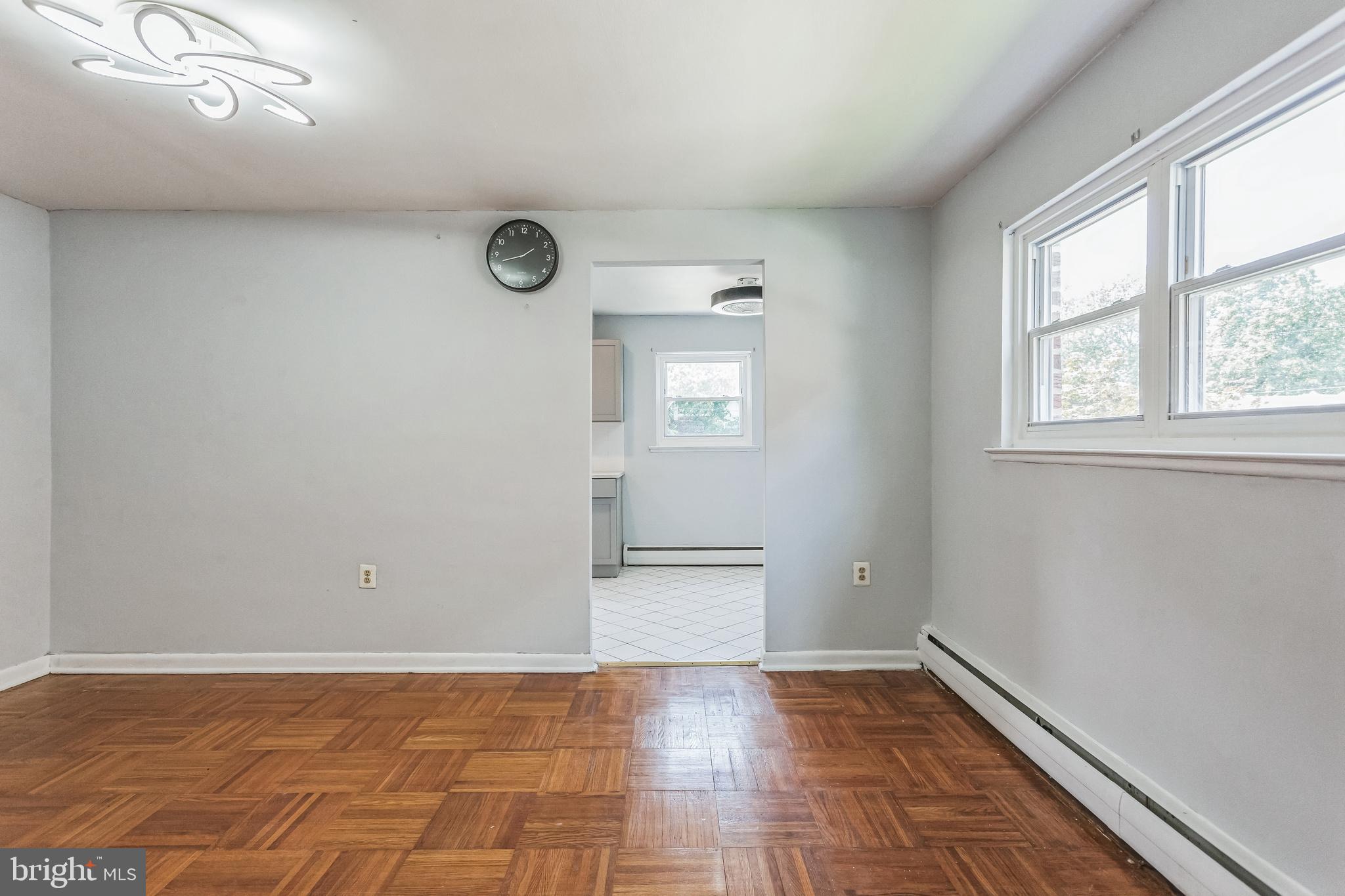 1125 Solly Avenue Philadelphia, PA 19111 - Photo 8 of 49 a view of empty room with wooden floor and fan
