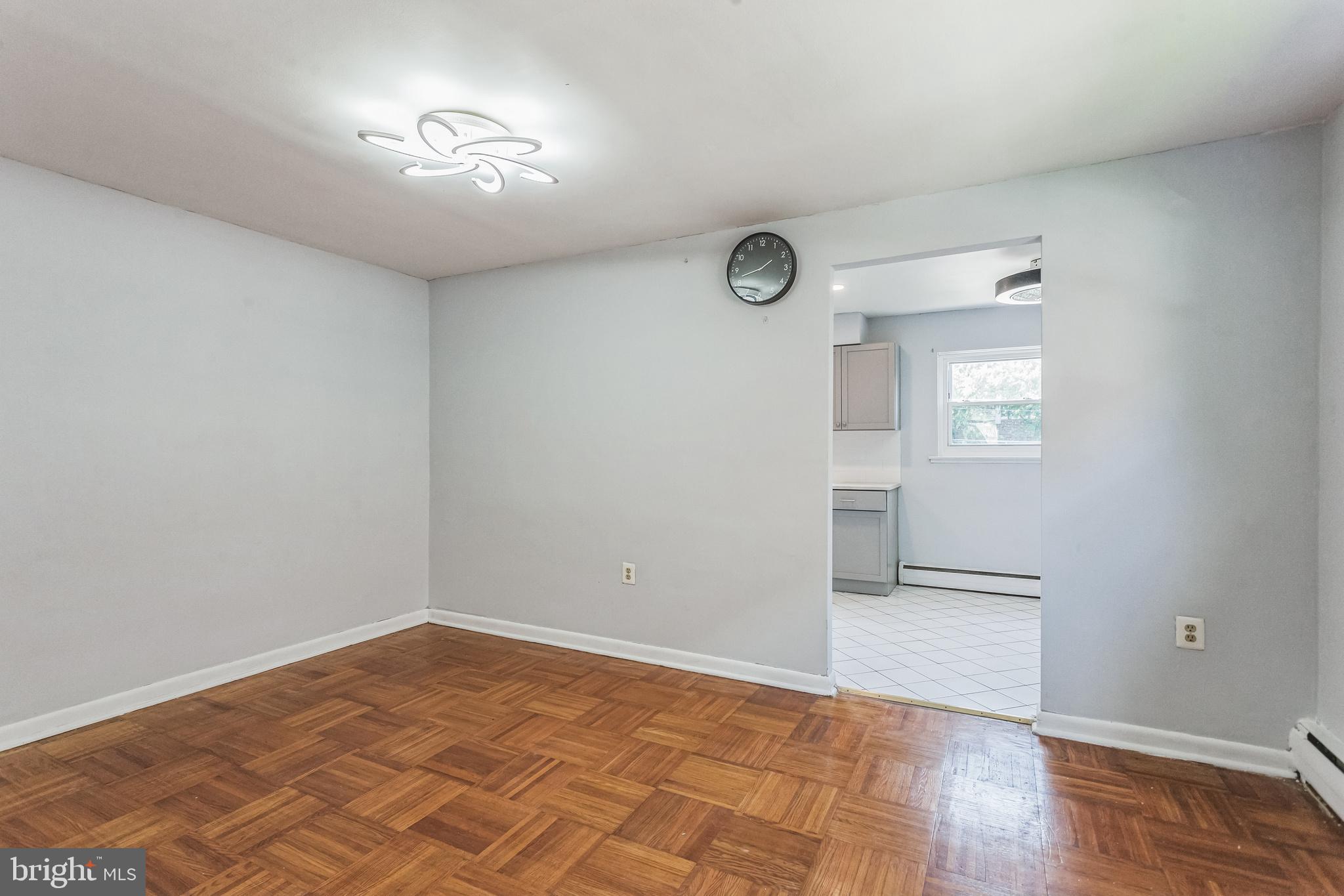 1125 Solly Avenue Philadelphia, PA 19111 - Photo 10 of 49 a view of empty room with wooden floor and fan