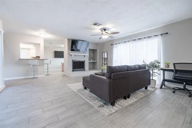 a bedroom with two beds and a chandelier