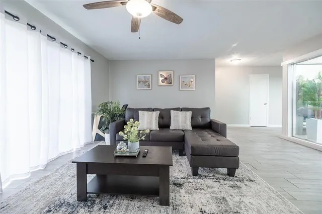 a living room with furniture and a large window
