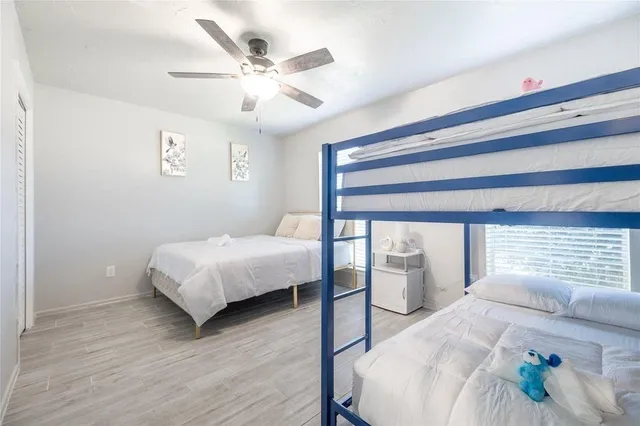 a bedroom with a bed and window