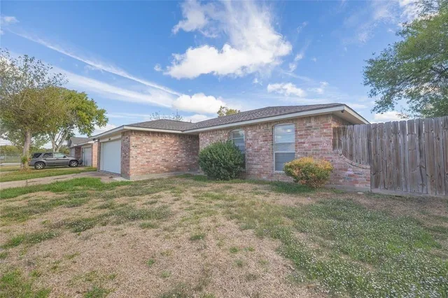 a view of a house with a back yard