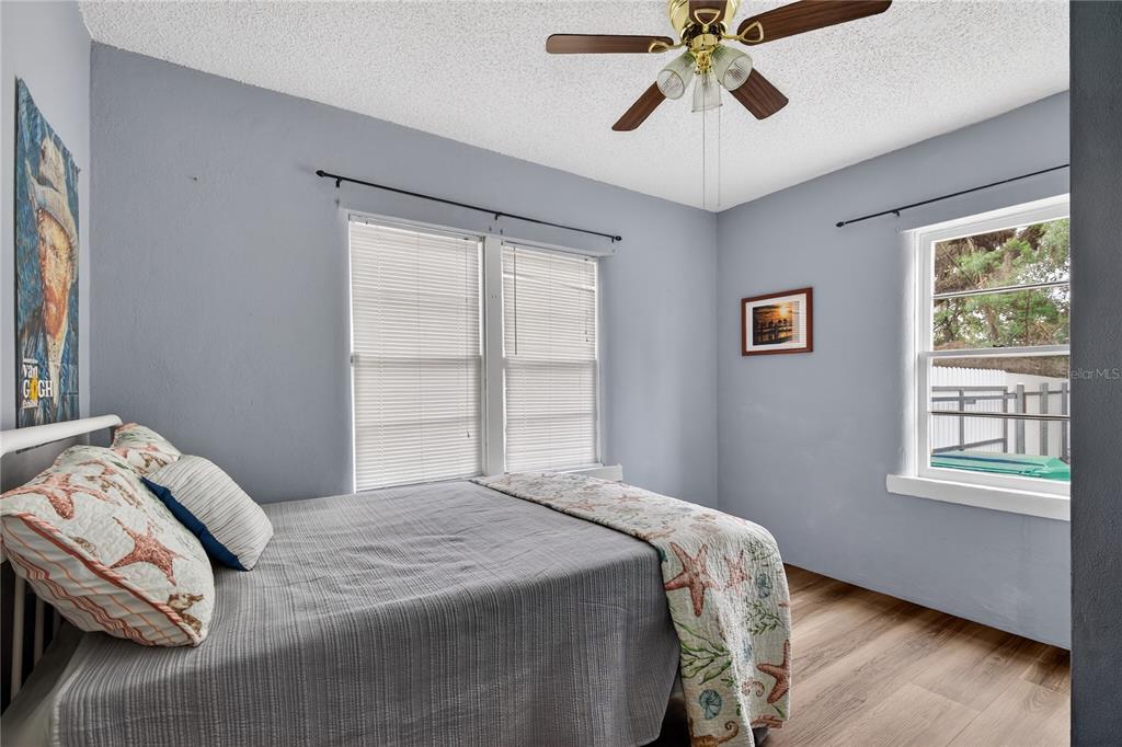 521 Michigan Street Mount Dora, FL 32757 - Photo 14 of 27 a bedroom with a bed and a window