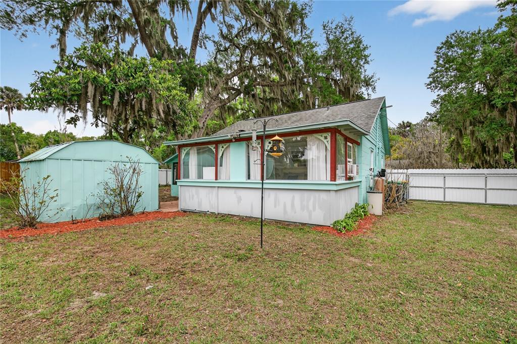 521 Michigan Street Mount Dora, FL 32757 - Photo 23 of 27 a house that has a tree in front of it