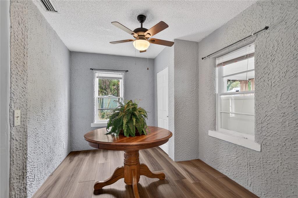 521 Michigan Street Mount Dora, FL 32757 - Photo 9 of 27 a view of a livingroom with furniture wooden floor a chandelier fan and a window