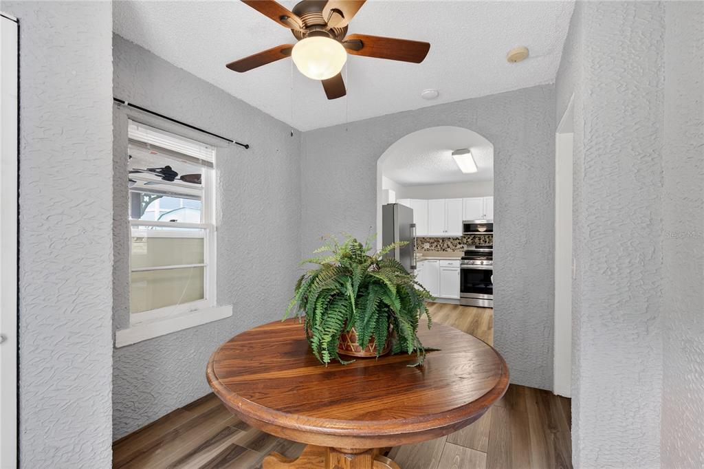 521 Michigan Street Mount Dora, FL 32757 - Photo 10 of 27 a dining room with furniture and wooden floor