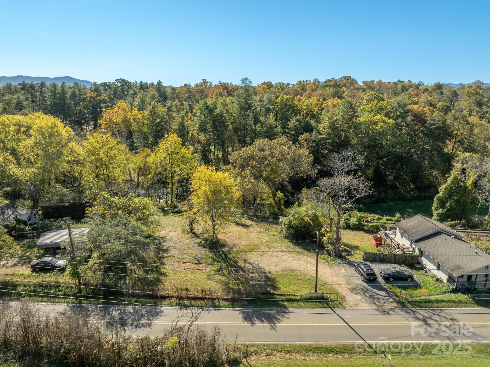 99999 Emma Road, Unit 2 Asheville, NC 28806 - Photo 2 of 11 a view of a lake with a mountain in the background
