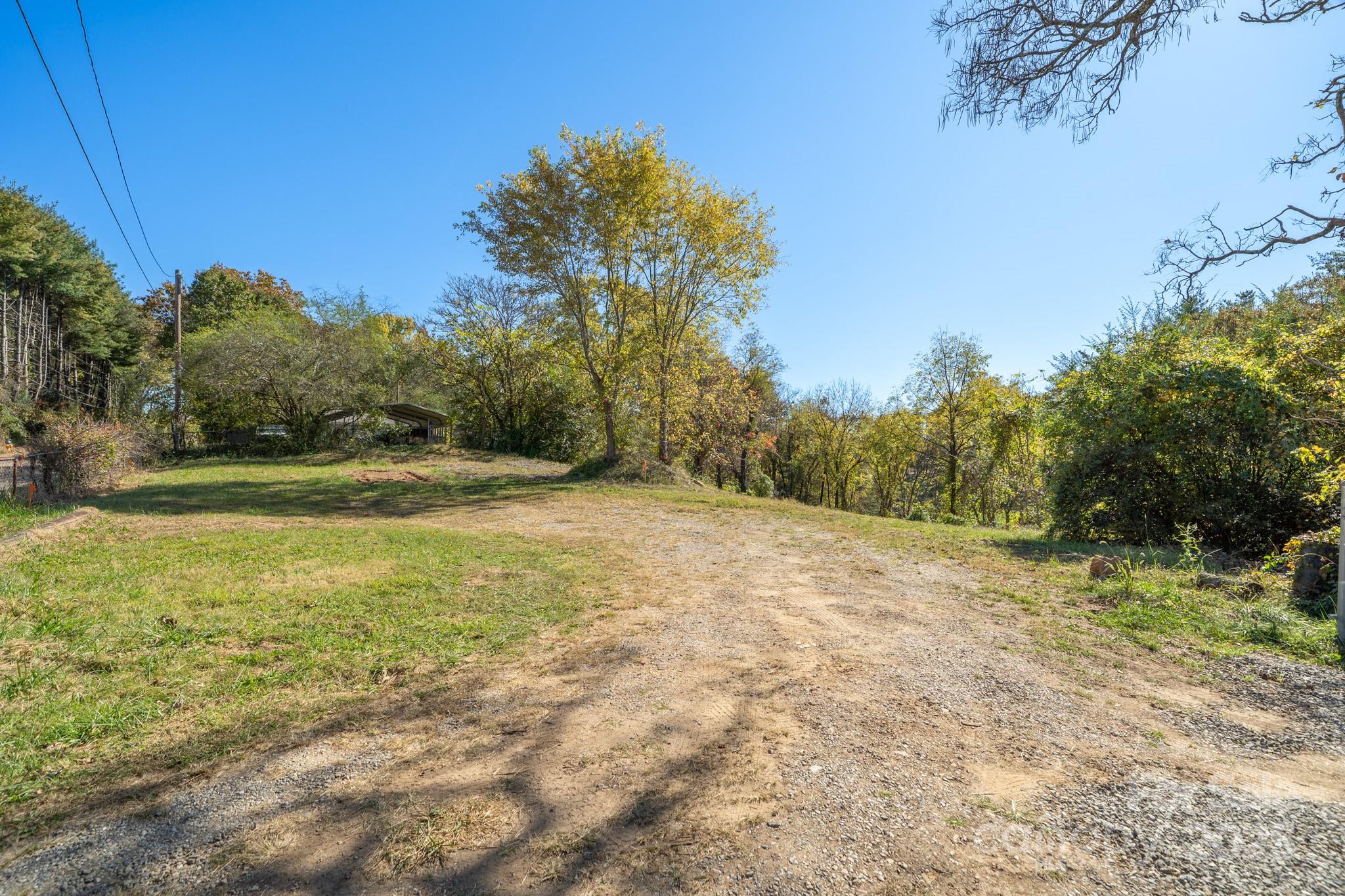 99999 Emma Road, Unit 2 Asheville, NC 28806 - Photo 10 of 11 a view of a field with trees in the background