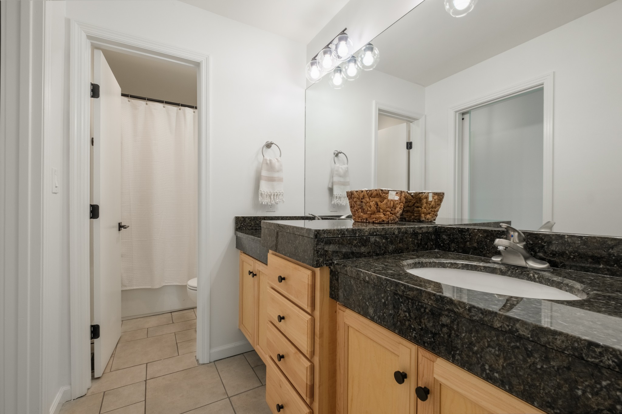 880 High Point Ridge Road Franklin, TN 37069 - Photo 25 of 51 a bathroom with a granite countertop sink and a mirror