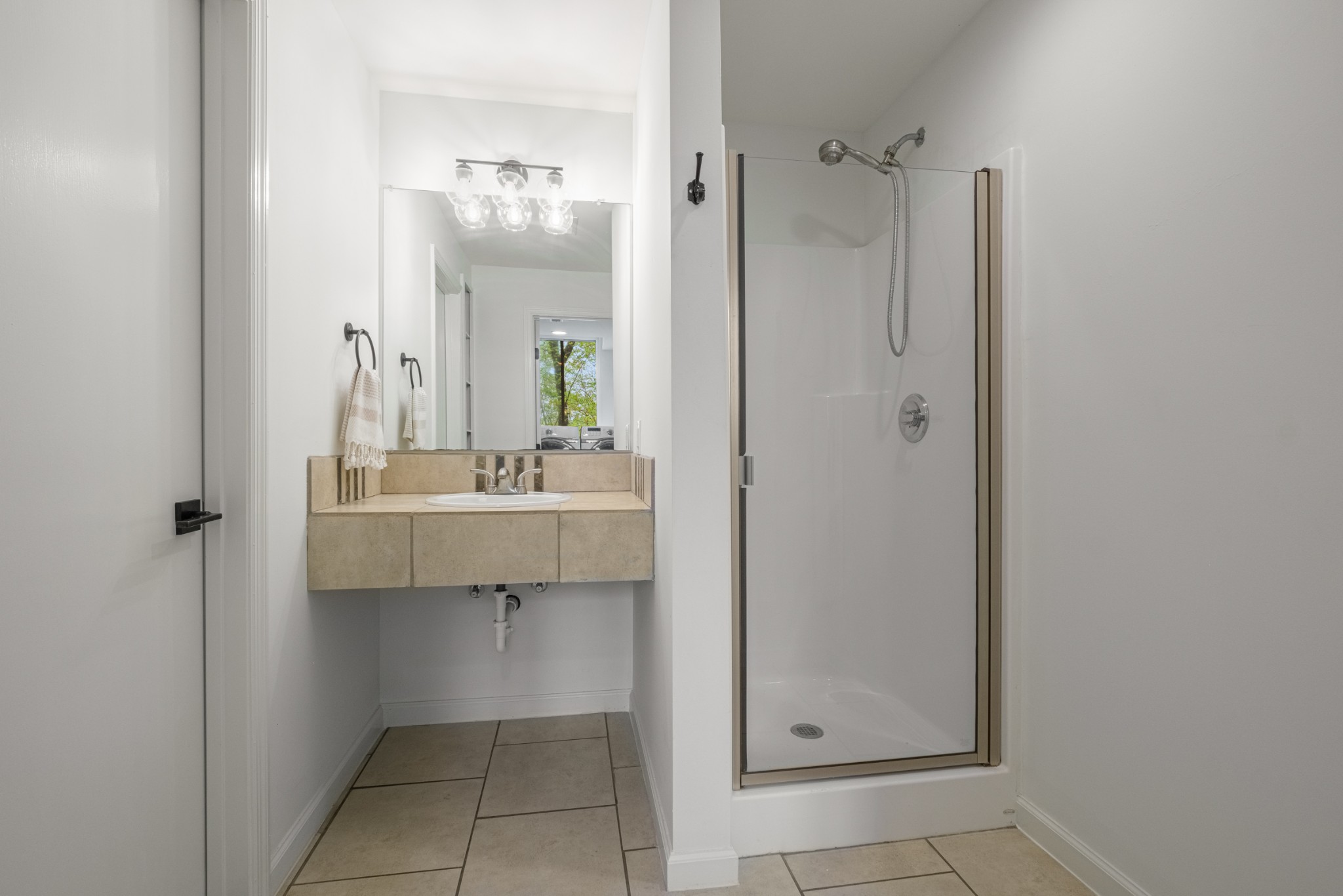 880 High Point Ridge Road Franklin, TN 37069 - Photo 31 of 51 a bathroom with a sink a mirror and a shower