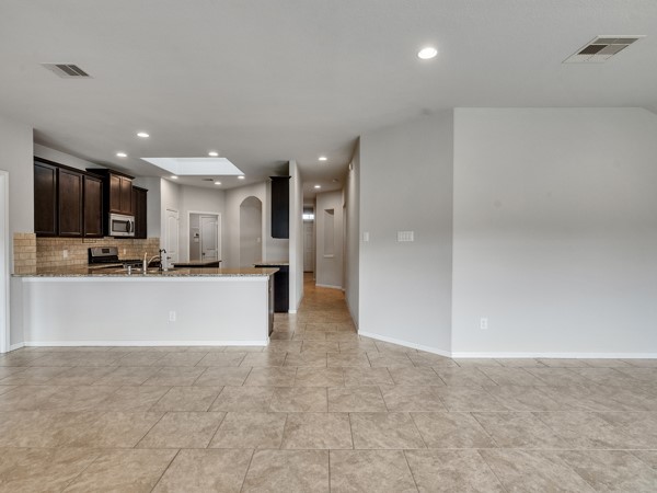 2939 Canadian Goose Lane Baytown, TX 77521 - Photo 14 of 44 The breakfast bar is open to the living area and perfect for entertaining.
