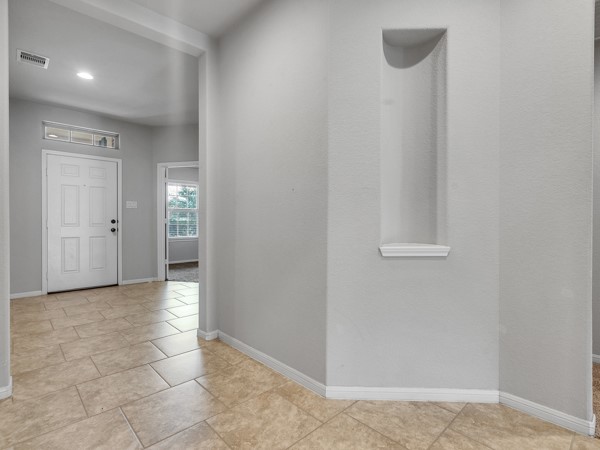 2939 Canadian Goose Lane Baytown, TX 77521 - Photo 14 of 48 a view of a hallway with closet and a bathroom