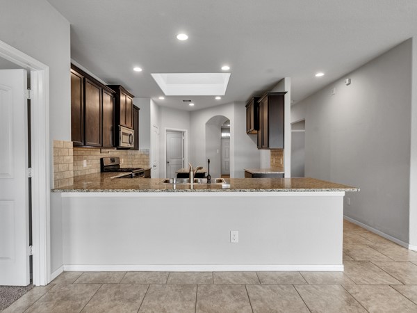 2939 Canadian Goose Lane Baytown, TX 77521 - Photo 17 of 44 The skylight offers beautiful natural lighting.