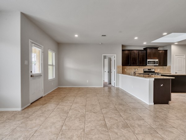 2939 Canadian Goose Lane Baytown, TX 77521 - Photo 18 of 48 a view of kitchen with refrigerator and microwave