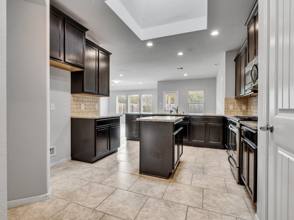 2939 Canadian Goose Lane Baytown, TX 77521 - Photo 19 of 48 a kitchen with a refrigerator and a sink