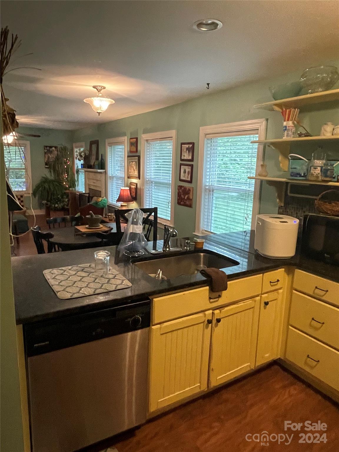 64 Deaton Street Ruby, SC 29741 - Photo 8 of 23 a kitchen with stainless steel appliances granite countertop a sink stove and cabinets