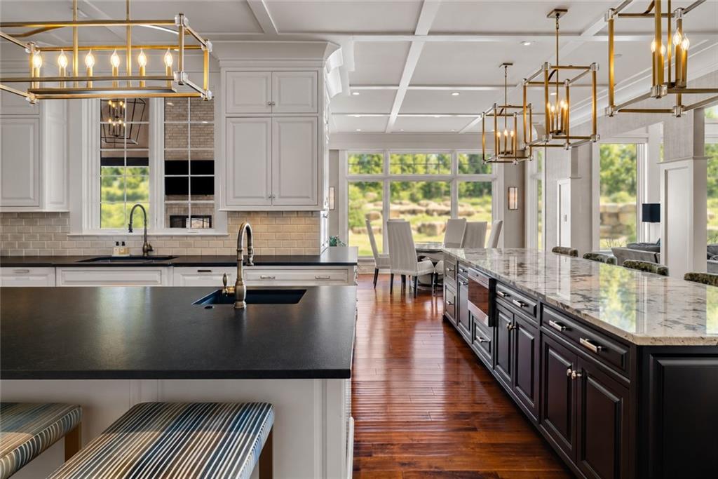 435 Myoma Road Mars, PA 16046 - Photo 12 of 50 Open-concept kitchen with a substantial island flowing naturally into a sunlit casual dining area.