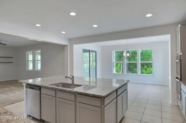 a bathroom with a sink and a large mirror