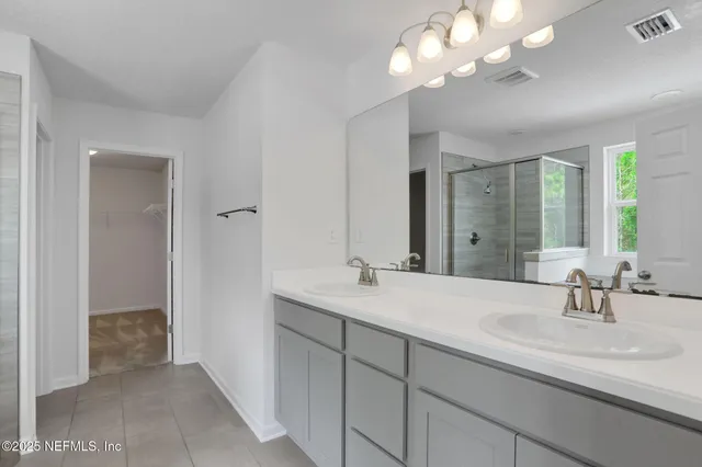 a bathroom with a bathtub and window