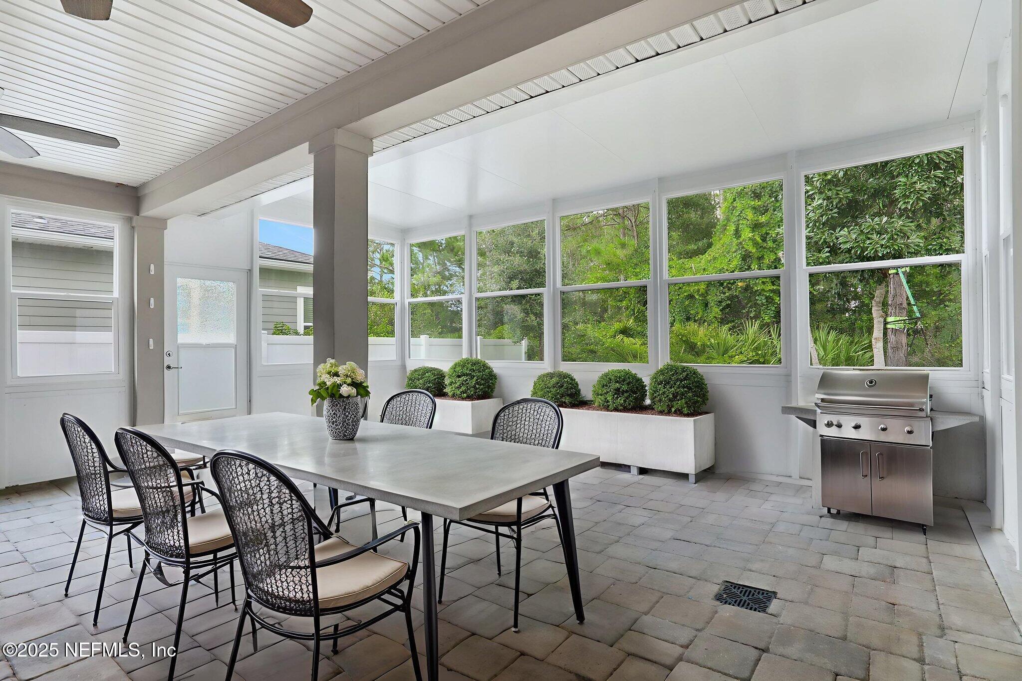 277 Sandstone Drive St. Augustine, FL 32086 - Photo 33 of 47 a dining room with furniture and a large window