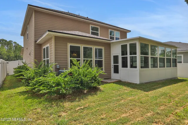 a view of outdoor space with deck and yard