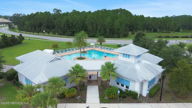 a view of a swimming pool with a yard