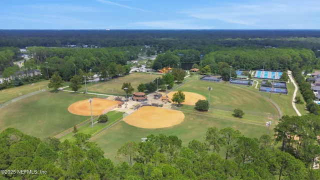 a view of a swimming pool with a yard