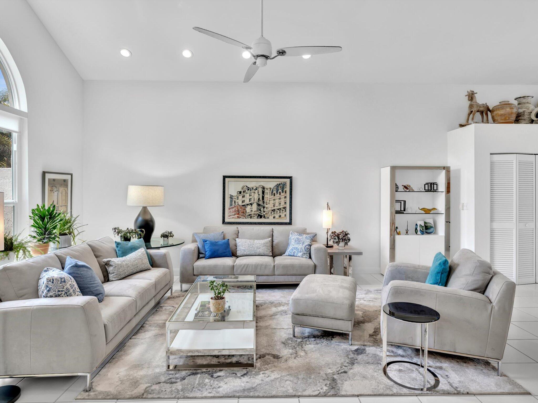 6307 Via Palladium Boca Raton, FL 33433 - Photo 22 of 85 a living room with furniture a rug and a chandelier