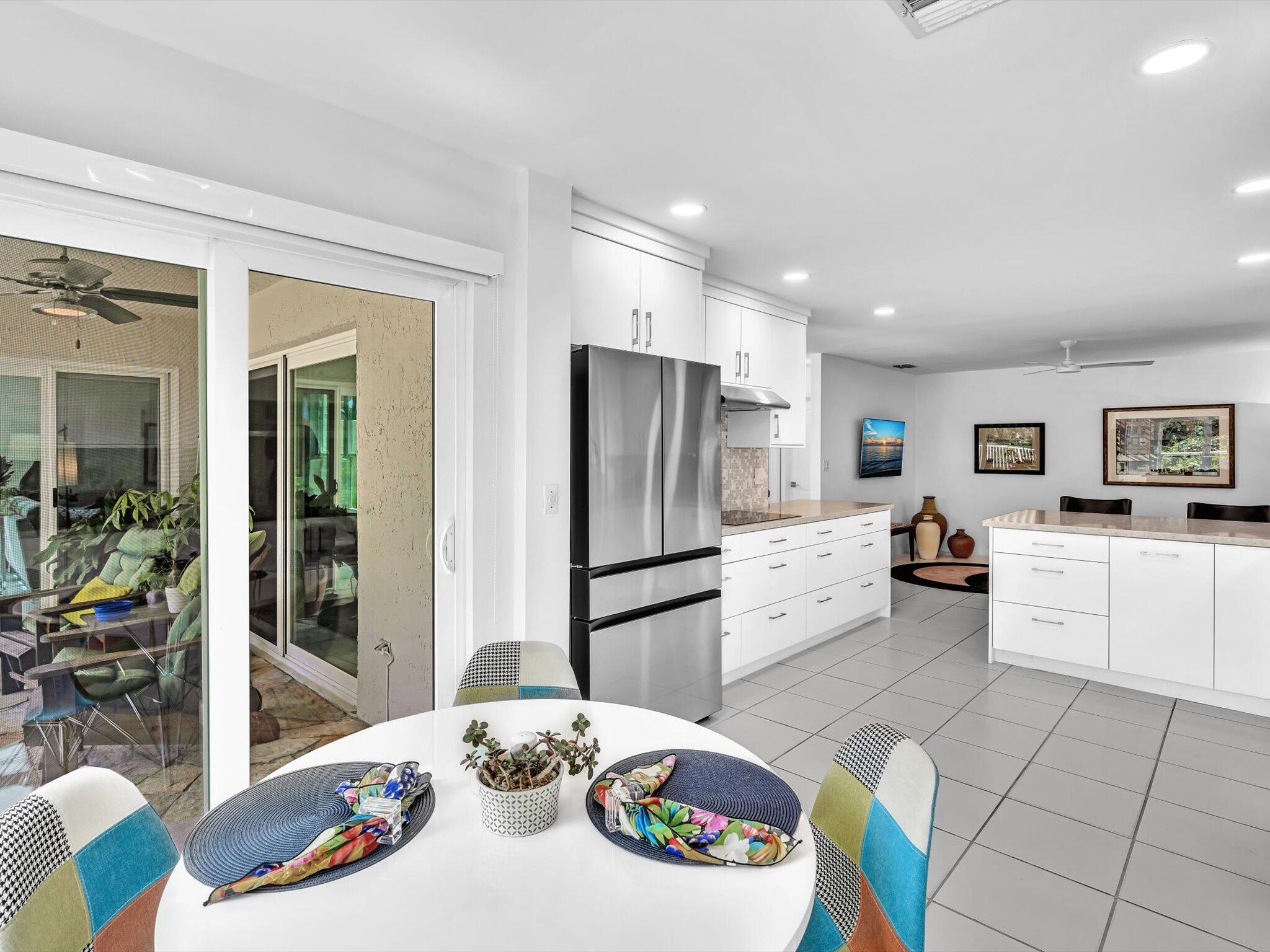 6307 Via Palladium Boca Raton, FL 33433 - Photo 36 of 85 a kitchen with stainless steel appliances wooden floor and white cabinets