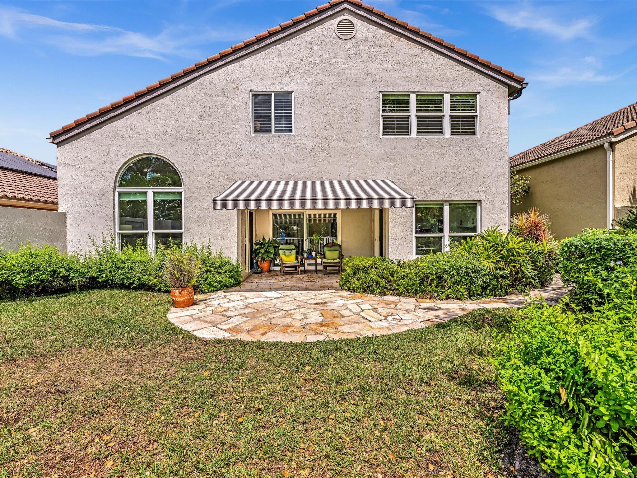 6307 Via Palladium Boca Raton, FL 33433 - Photo 43 of 85 a front view of a house with a yard