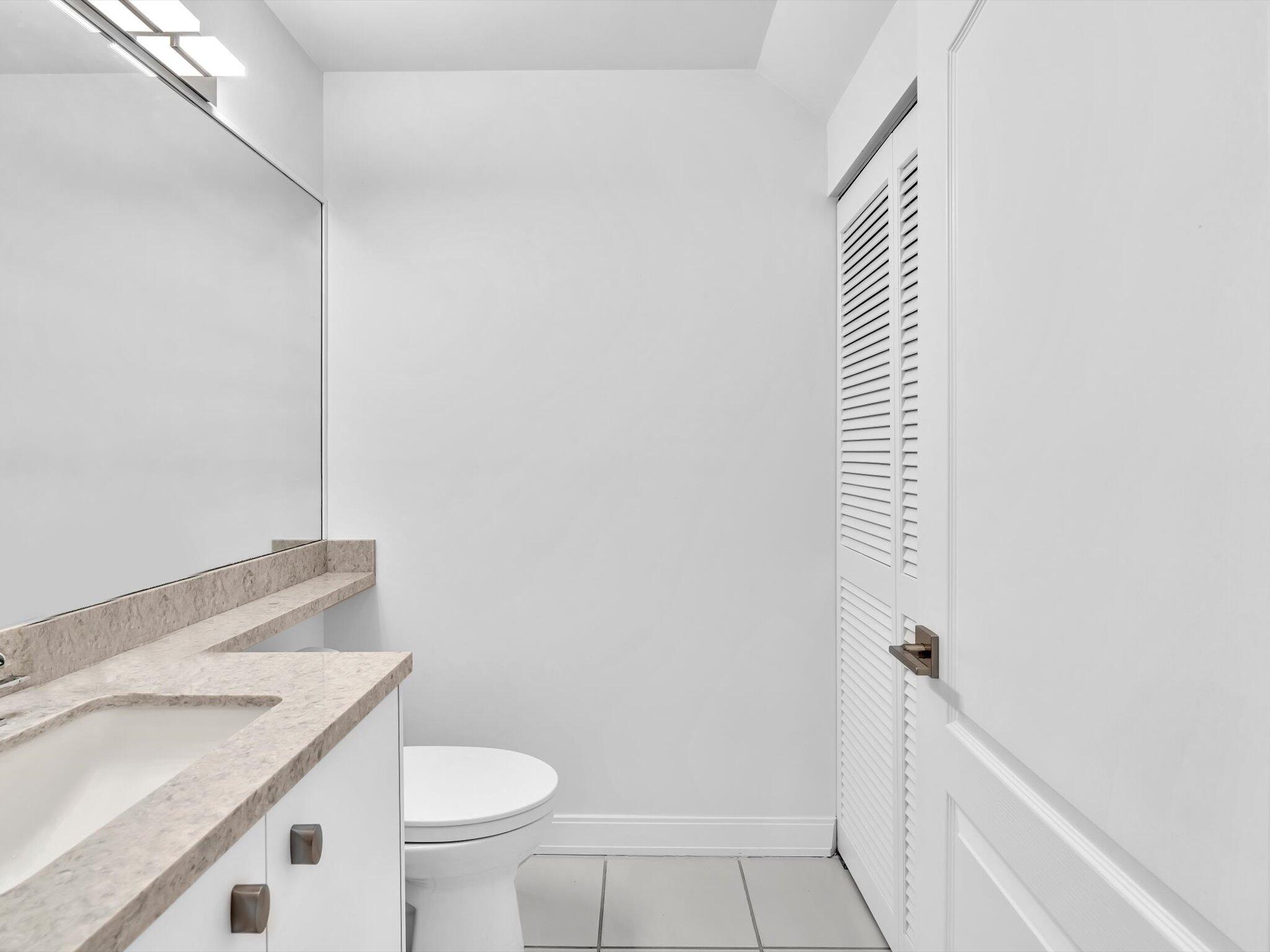 6307 Via Palladium Boca Raton, FL 33433 - Photo 45 of 85 a bathroom with a sink and toilet