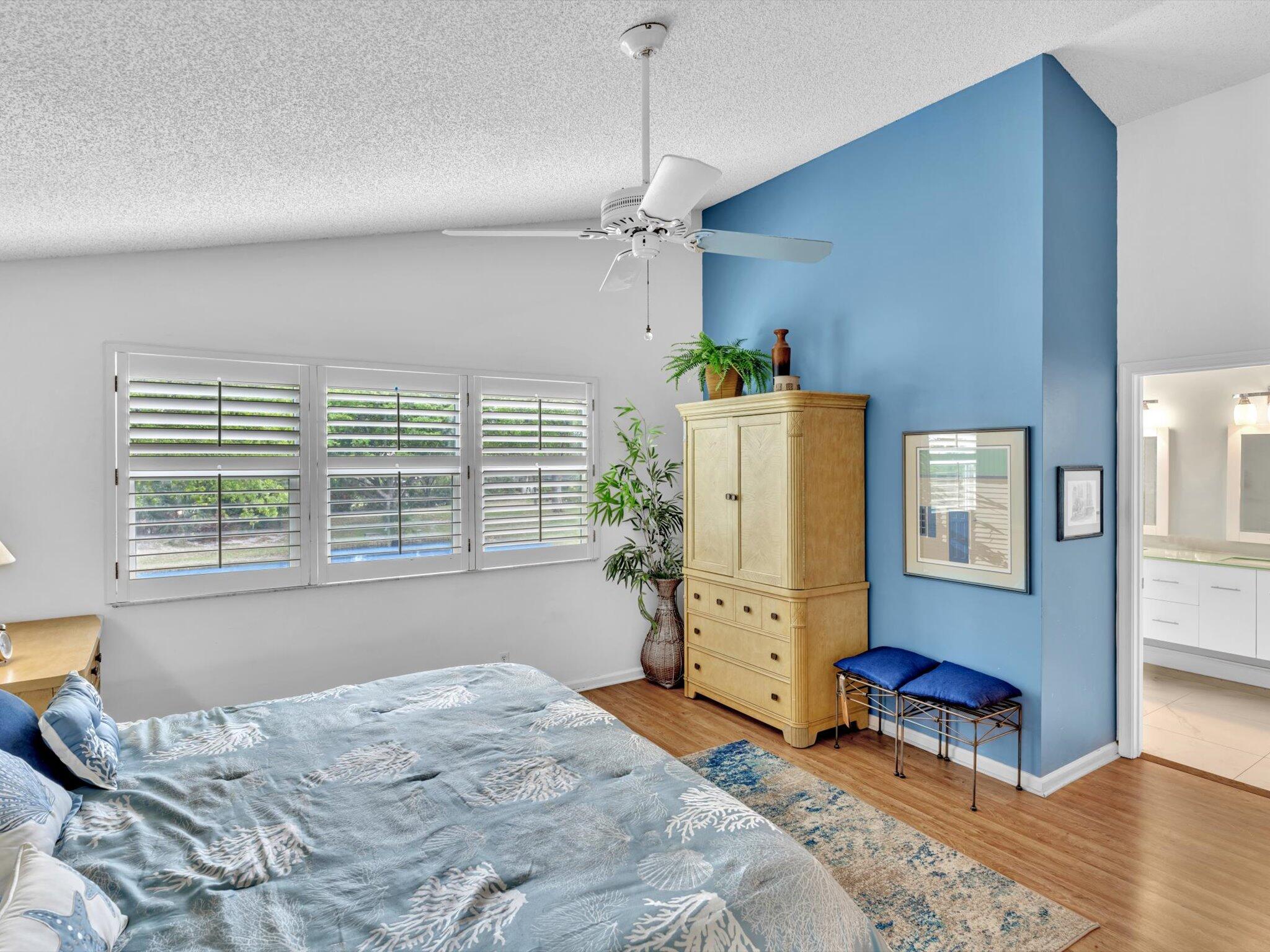 6307 Via Palladium Boca Raton, FL 33433 - Photo 51 of 85 a bedroom with a bed dresser and a window