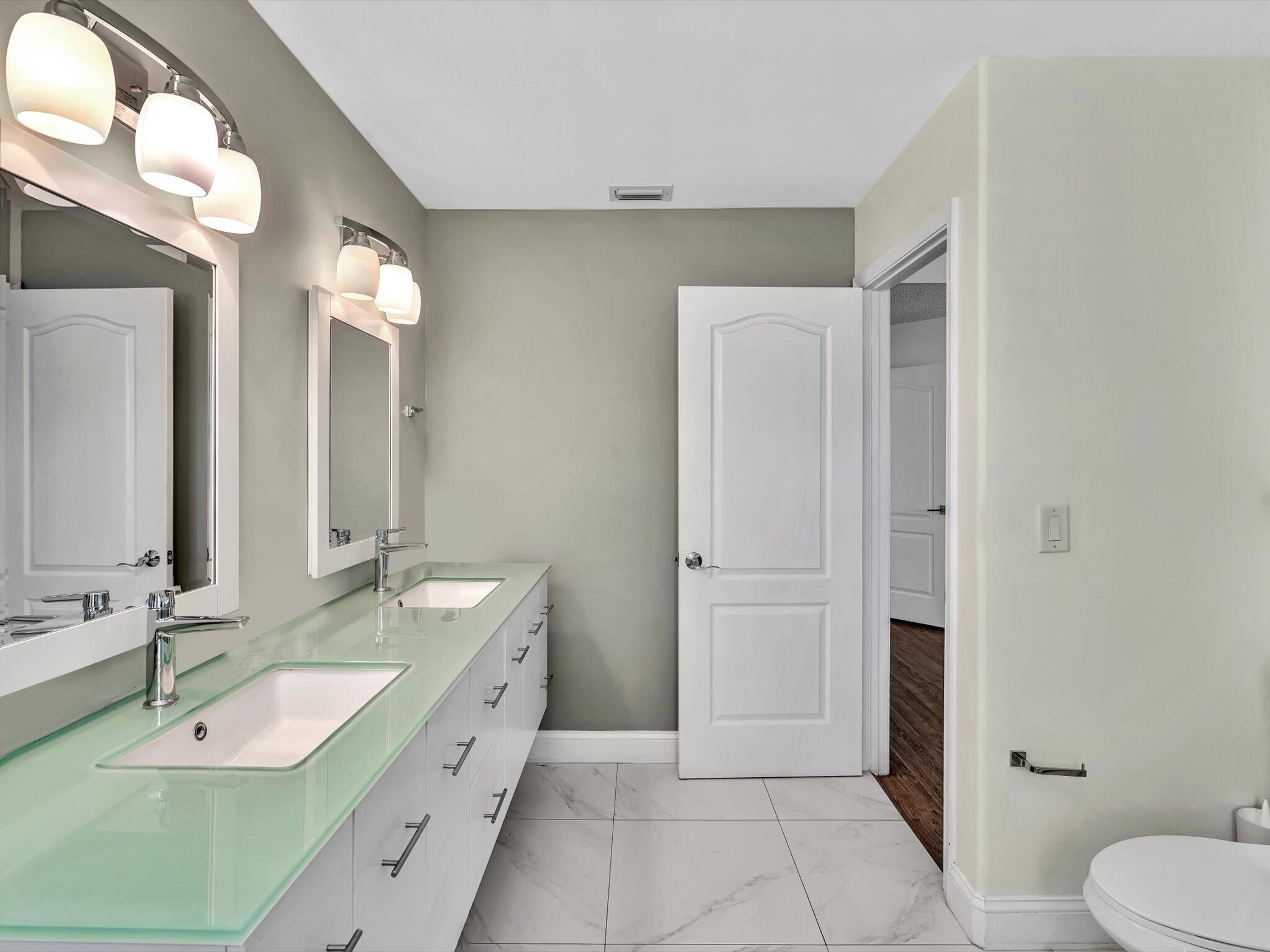 6307 Via Palladium Boca Raton, FL 33433 - Photo 54 of 85 a spacious bathroom with a double vanity sink and a mirror