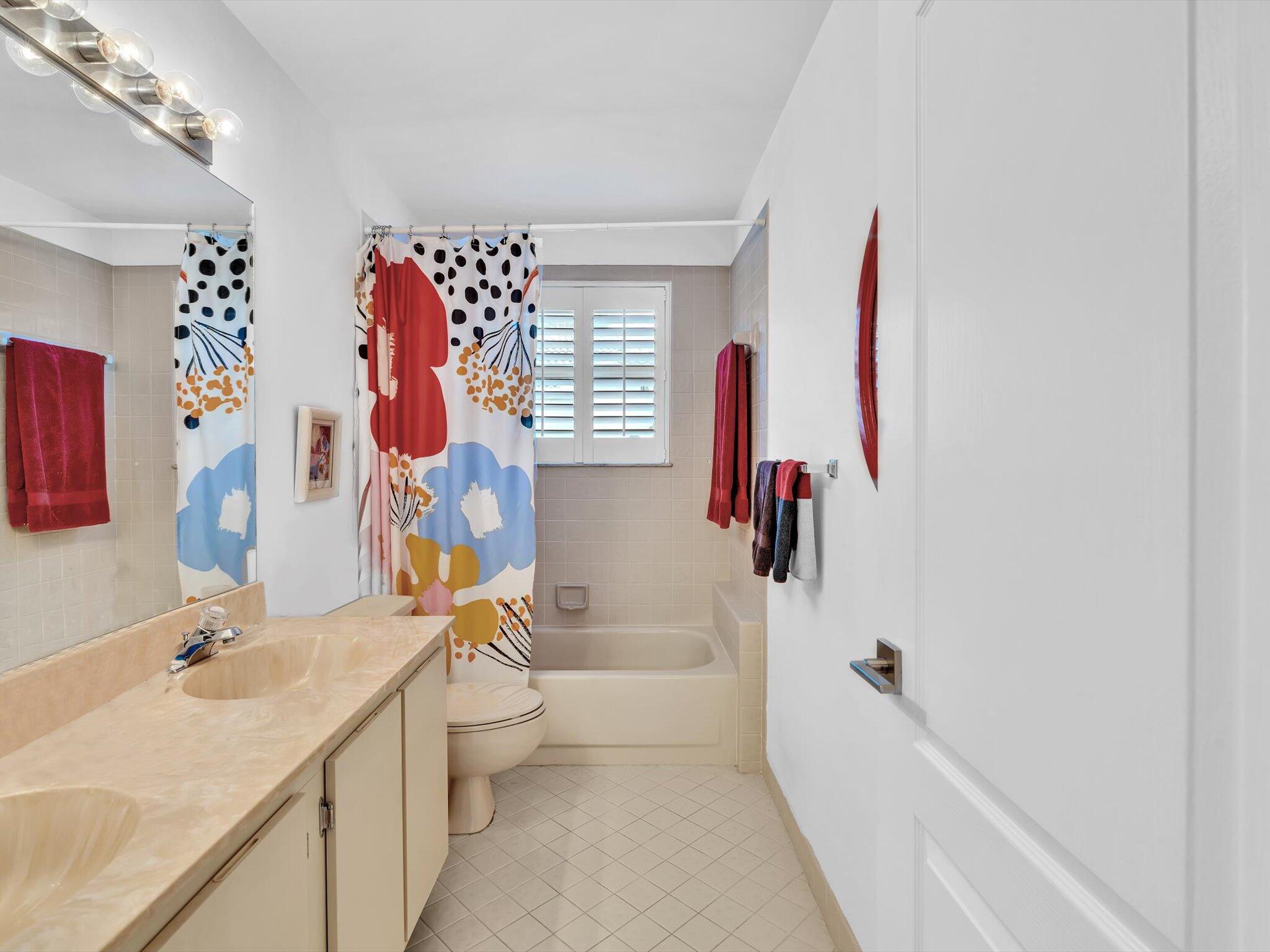 6307 Via Palladium Boca Raton, FL 33433 - Photo 58 of 85 a bathroom with a sink vanity mirror bathtub and toilet