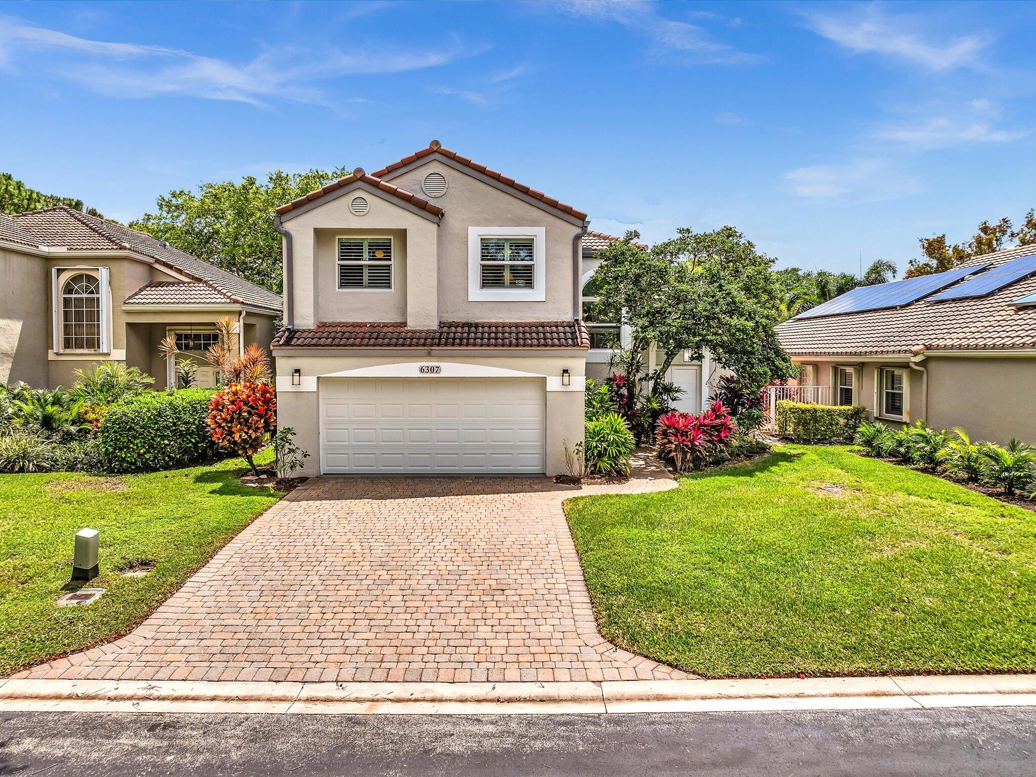 6307 Via Palladium Boca Raton, FL 33433 - Photo 66 of 85 a front view of a house with a garden
