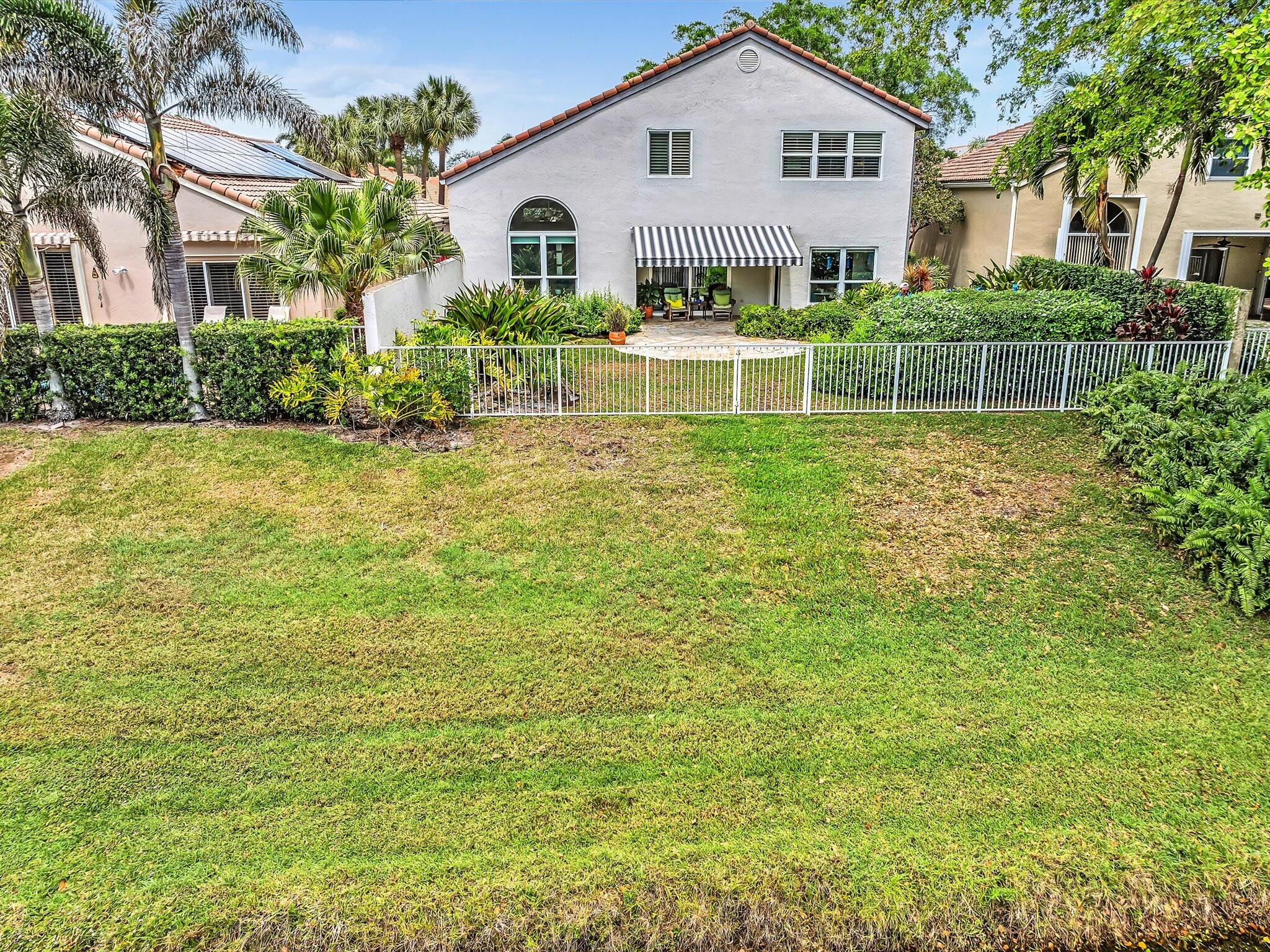 6307 Via Palladium Boca Raton, FL 33433 - Photo 75 of 85 a view of a house with a big yard and large trees