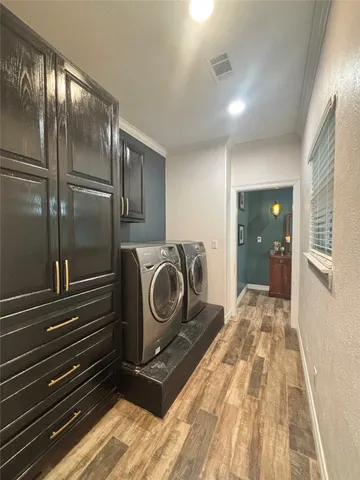 a view of a hallway with washer and dryer