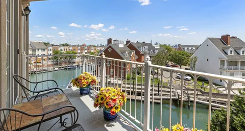 a view of a balcony with chairs