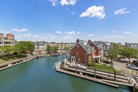a view of a house with swimming pool and deck