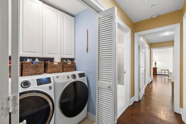 a view of a hallway with washer and dryer