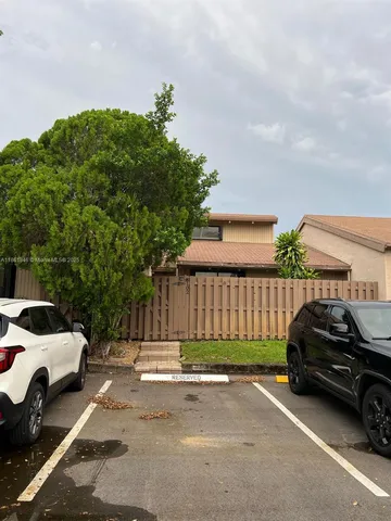 a view of a car parked in front of a house