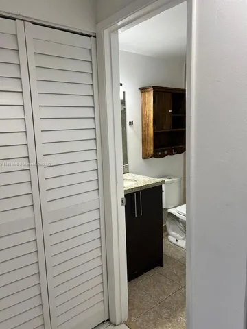 a bathroom with a shower and a sink