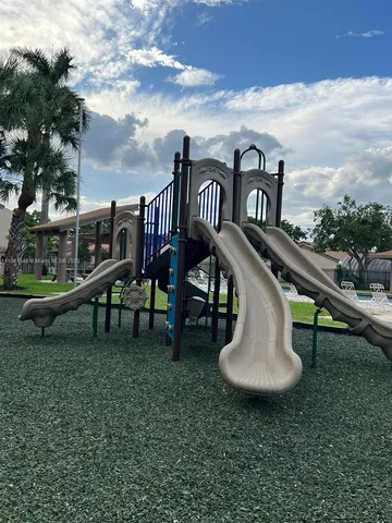 a view of swimming pool with seating space