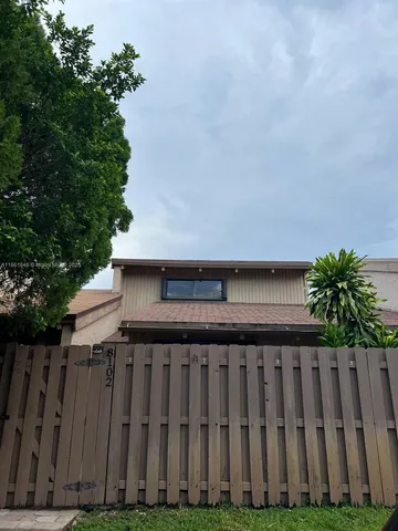 a view of a house with a garden