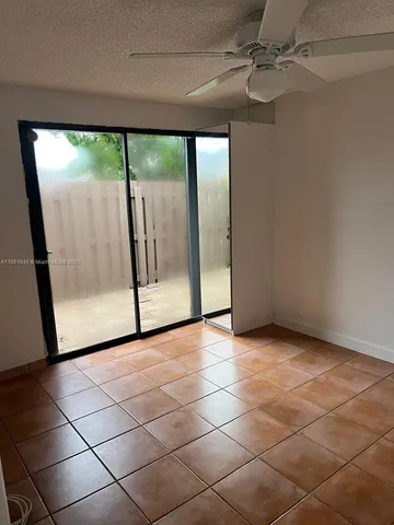 a view of a room with sliding glass door