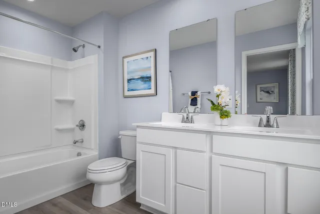 a bedroom with a bed and a lamp