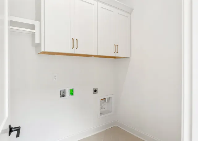 a view of small space with white cabinets